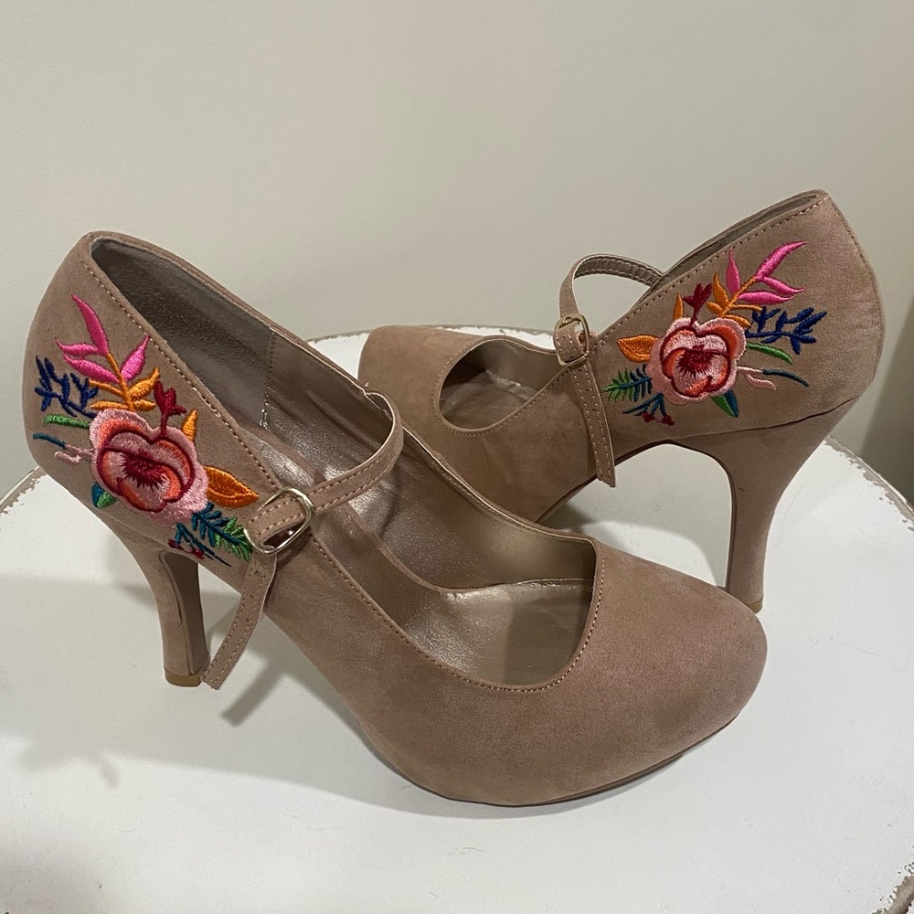 Tan High heals with colorful embroidery on the heels.